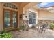 Welcoming front porch with a decorative fountain, seating, and stone accents at 17923 Arbor Haven Dr, Tampa, FL 33647