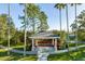Gazebo nestled among mature palm trees provides a serene spot to relax and enjoy nature at 17923 Arbor Haven Dr, Tampa, FL 33647