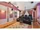 A home theater features leather recliners, large screen, projector and sconce lighting at 17923 Arbor Haven Dr, Tampa, FL 33647