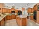 A kitchen with a kitchen island, stainless steel appliances and granite countertops at 17923 Arbor Haven Dr, Tampa, FL 33647