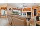 Inviting living room showcasing a fireplace, neutral-toned furniture, and a view of the outdoor pool area at 17923 Arbor Haven Dr, Tampa, FL 33647