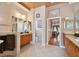 Bright bathroom features double sinks, tiled floors, and neutral color scheme at 17923 Arbor Haven Dr, Tampa, FL 33647