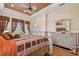 Large main bedroom showcases wood floors, tray ceiling, and bright windows at 17923 Arbor Haven Dr, Tampa, FL 33647