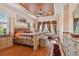 Spacious main bedroom features tray ceiling, wood floors, and sitting area at 17923 Arbor Haven Dr, Tampa, FL 33647
