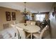 Inviting dining room with an elegant chandelier, adjacent to the living area at 1846 Golfview Dr # 1846, Tarpon Springs, FL 34689