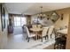 Dining area that has views of living room and outside balcony at 1846 Golfview Dr # 1846, Tarpon Springs, FL 34689