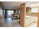 Open concept kitchen and dining area with views into the living room at 1846 Golfview Dr # 1846, Tarpon Springs, FL 34689