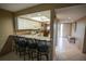 Bright kitchen with an eat-in counter, ceiling fan, and tile floors at 1846 Golfview Dr # 1846, Tarpon Springs, FL 34689