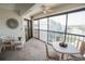 Comfortable lanai with seating and views of the surrounding landscape at 1846 Golfview Dr # 1846, Tarpon Springs, FL 34689