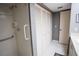 Accessible tiled shower with grab bar, next to spacious closet at 1846 Golfview Dr # 1846, Tarpon Springs, FL 34689