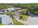 Aerial view of the home's landscaping, driveway, and neighborhood street at 1944 Hastings Ln, Clearwater, FL 33763