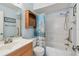 Bathroom featuring a shower-tub combination and wooden vanity at 1944 Hastings Ln, Clearwater, FL 33763