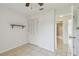 Bedroom with tiled floors, closet, and adjacent bathroom at 1944 Hastings Ln, Clearwater, FL 33763