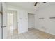 Bedroom with closet and tiled flooring provides ample space and storage at 1944 Hastings Ln, Clearwater, FL 33763