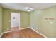 Dining area with a light fixture, tile flooring and a door leading to another room at 1944 Hastings Ln, Clearwater, FL 33763