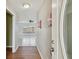 Bright and airy entryway with wood floors and a clear view into the living room at 1944 Hastings Ln, Clearwater, FL 33763