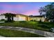 Charming single-story home with well-manicured lawn, lush landscaping, and a two-car garage at 1944 Hastings Ln, Clearwater, FL 33763