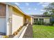 Charming front entrance with a landscaped walkway and inviting light fixture at 1944 Hastings Ln, Clearwater, FL 33763
