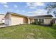 Inviting single-story home with lush green lawn at 1944 Hastings Ln, Clearwater, FL 33763