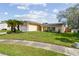 Lovely single-story home featuring lush lawn and a two-car garage at 1944 Hastings Ln, Clearwater, FL 33763