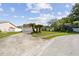 Charming single-story home featuring green lawn and a two-car garage at 1944 Hastings Ln, Clearwater, FL 33763