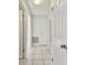 Hallway features tile flooring and leads to multiple rooms at 1944 Hastings Ln, Clearwater, FL 33763
