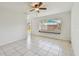 Bright living room with tiled floors, ceiling fan, and natural light at 1944 Hastings Ln, Clearwater, FL 33763