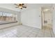 Bright living room with tiled floors, ceiling fan, and open layout at 1944 Hastings Ln, Clearwater, FL 33763