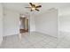 Open-concept living space with tile floors leading to front door and other rooms at 1944 Hastings Ln, Clearwater, FL 33763