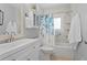Neat bathroom featuring a combination shower and tub, a vanity, and neutral walls at 2136 Cunningham Dr, Clearwater, FL 33763