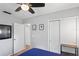 Functional bedroom featuring hardwood floors, a ceiling fan, and a convenient closet at 2136 Cunningham Dr, Clearwater, FL 33763