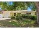 Inviting single-Gathering home with a well-kept lawn, charming front garden, and a welcoming entrance, perfect for a cozy lifestyle at 2136 Cunningham Dr, Clearwater, FL 33763