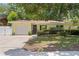 Charming single-story home with a well-maintained front yard, a garage, and a welcoming entrance at 2136 Cunningham Dr, Clearwater, FL 33763