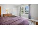 Bedroom featuring wood floors, a light fixture, and natural light through the windows at 2723 8Th N Ave, St Petersburg, FL 33713