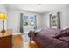 Cozy bedroom with hardwood floors, two bright windows, and classic decor at 2723 8Th N Ave, St Petersburg, FL 33713