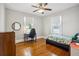 Bedroom with hardwood floors, ceiling fan, and natural light at 2723 8Th N Ave, St Petersburg, FL 33713