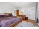 Bedroom featuring wood floors, a light fixture, and natural light through the windows at 2723 8Th N Ave, St Petersburg, FL 33713