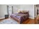 Bedroom featuring wood floors, a light fixture, and natural light through the windows at 2723 8Th N Ave, St Petersburg, FL 33713