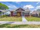 Charming single-Gathering home featuring a well-maintained lawn and a brick chimney at 2723 8Th N Ave, St Petersburg, FL 33713