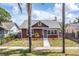 Charming single-Gathering home featuring a well-maintained lawn and a brick chimney at 2723 8Th N Ave, St Petersburg, FL 33713
