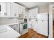Bright kitchen features white cabinets, a range, and ample counter space at 2723 8Th N Ave, St Petersburg, FL 33713