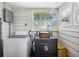 Functional laundry room with washer, dryer, and natural light at 2723 8Th N Ave, St Petersburg, FL 33713