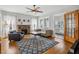 Bright living room with brick fireplace, ceiling fan, and hardwood floors at 2723 8Th N Ave, St Petersburg, FL 33713