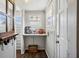 Well-organized mud room with hanging hooks, storage shelf, and natural light at 2723 8Th N Ave, St Petersburg, FL 33713