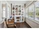 Sunlit room with built-in shelving and lots of natural light from surrounding windows at 2723 8Th N Ave, St Petersburg, FL 33713