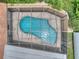 Aerial view of screened-in pool, landscaped yard, and hardscape showcasing outdoor living at its finest at 313 Oak Crest Dr, Safety Harbor, FL 34695