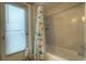 Bathroom featuring a tub and shower with sea-themed shower curtain at 313 Oak Crest Dr, Safety Harbor, FL 34695