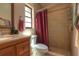 Bathroom with tile walls, shower, sink, and vanity with plenty of natural light at 313 Oak Crest Dr, Safety Harbor, FL 34695