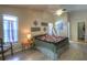 Bedroom with light walls, ceiling fan, wood floors, and large window for natural light at 313 Oak Crest Dr, Safety Harbor, FL 34695