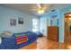 Light blue bedroom with hardwood floors, closet, and dresser at 313 Oak Crest Dr, Safety Harbor, FL 34695